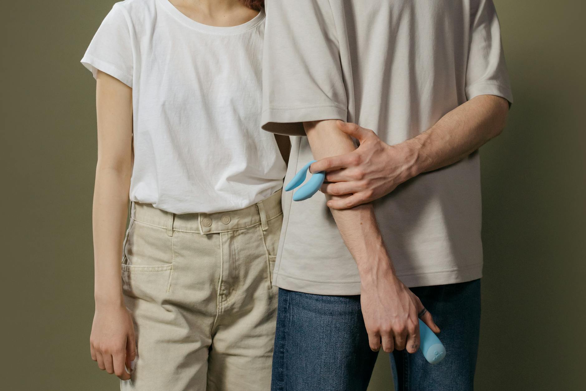 A couple sitting together, exploring new intimacy tools with openness and trust